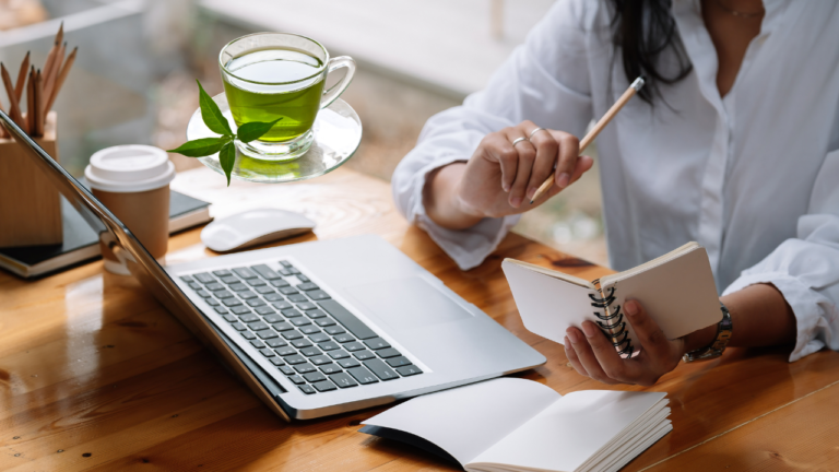 a cup of green tea on the desk