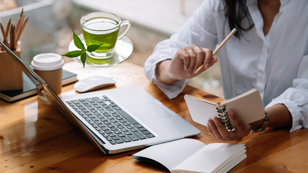 a cup of green tea on the desk